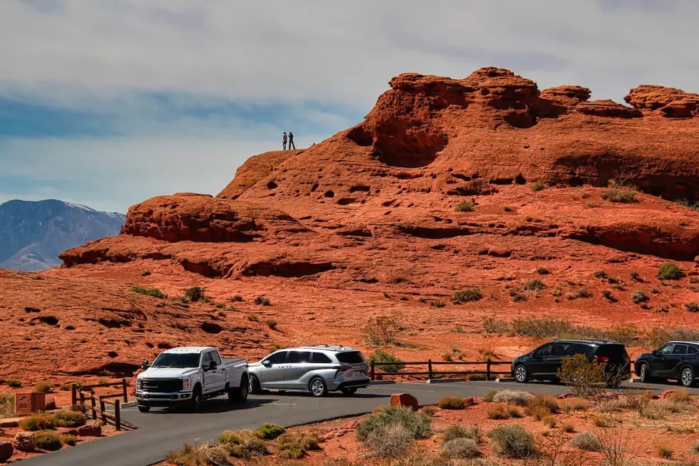 People Climbing on the Red Rocks of Pioneer Park in St. George Utah