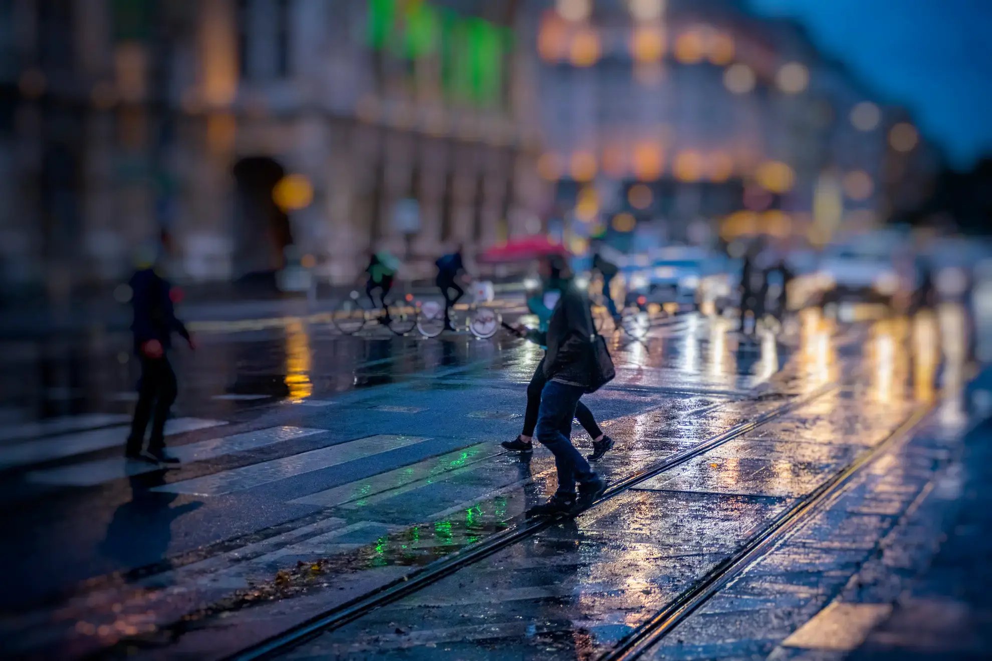Cyclists and pedestrians in the city rain
